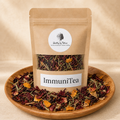 ImmuniTea labeled kraft tea pouch on a warm herbal backdrop